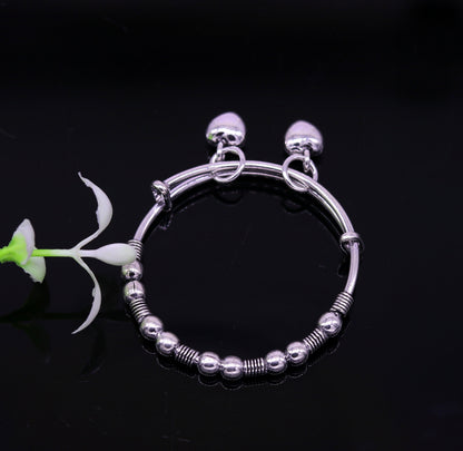 Vintage style oxidized 925 sterling silver adjustable baby bangle bracelet with tribal charm, unisex kids jewelry from Tribal Ornaments.