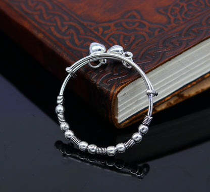 Vintage-style oxidized sterling silver baby bangle bracelet with tribal charm, adjustable unisex kids jewelry by Tribal Ornaments.