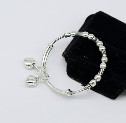 Vintage oxidized 925 sterling silver baby bangle bracelet with tribal charm, adjustable unisex kids jewelry by Tribal Ornaments.