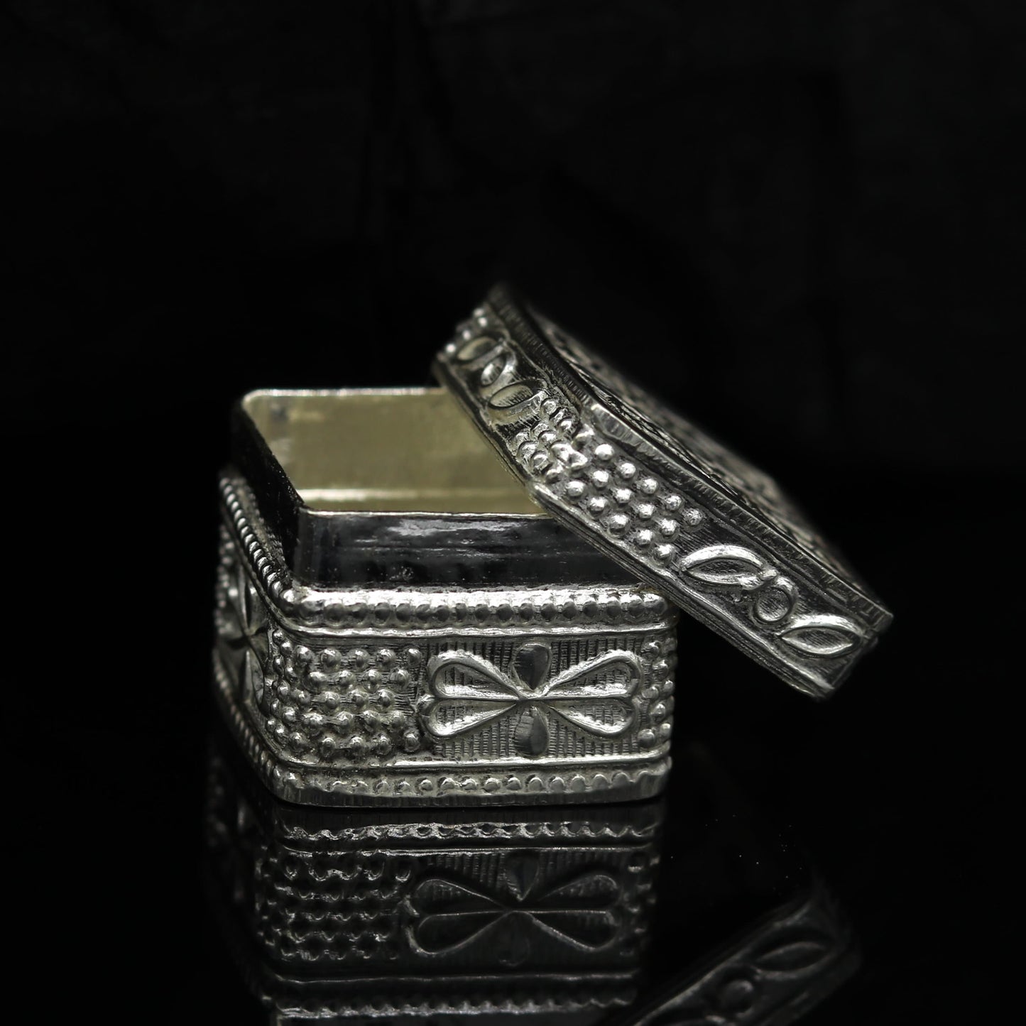 Vintage style small sterling silver bridal jewelry and trinket box with intricate tribal ornament design.