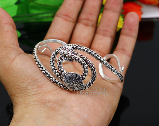 Sterling silver snake couple design bangle cuff by TRIBAL ORNAMENTS, stylish unisex jewelry with cobra motif, perfect for gifting.