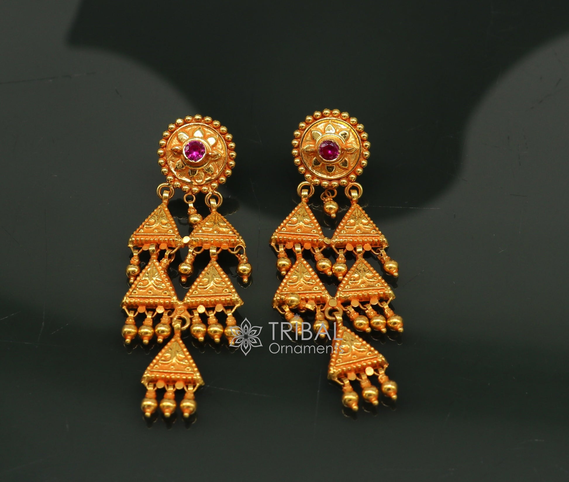 Vintage tribal earrings made of 22KT yellow gold featuring traditional Indian handcrafted cultural design.