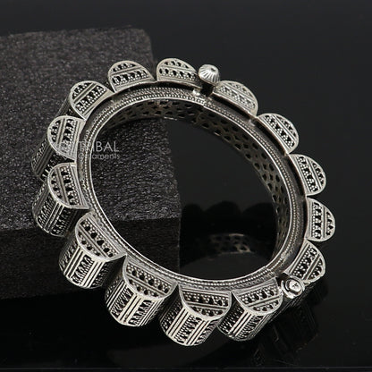 Sterling silver tribal bangle bracelet by TRIBAL ORNAMENTS featuring intricate cultural design for wedding and dance jewelry.