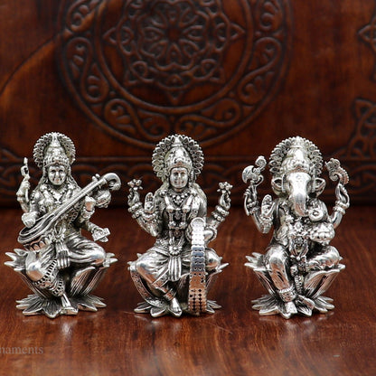 Small 2-inch handmade sterling silver Hindu idols of Ganesha, Laxmi, and Saraswati for puja, crafted by Tribal Ornaments.
