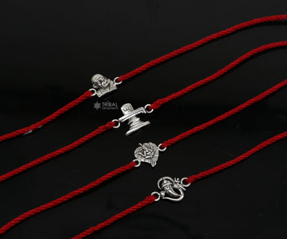 Handmade 925 sterling silver Ganesha, Shiva Lingam, Sai Baba idols bracelet with thread rakhi from TRIBAL ORNAMENTS.