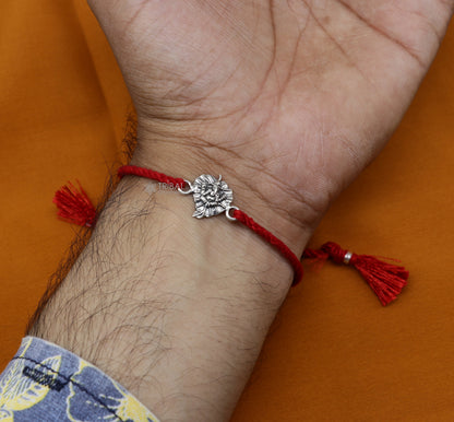 Handmade 925 sterling silver Ganesha, Shiva Lingam, Sai Baba idols on a unique thread rakhi bracelet by Tribal Ornaments.