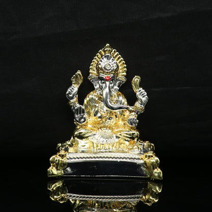 Silver Ganesh idol by TRIBAL ORNAMENTS featuring a silver-covered exterior with wax and marble details, Lord Ganesha figure.