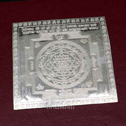 Handmade 925 sterling silver idol of Shree Kubera Yantram for wealth and prosperity, used as a divine puja article.