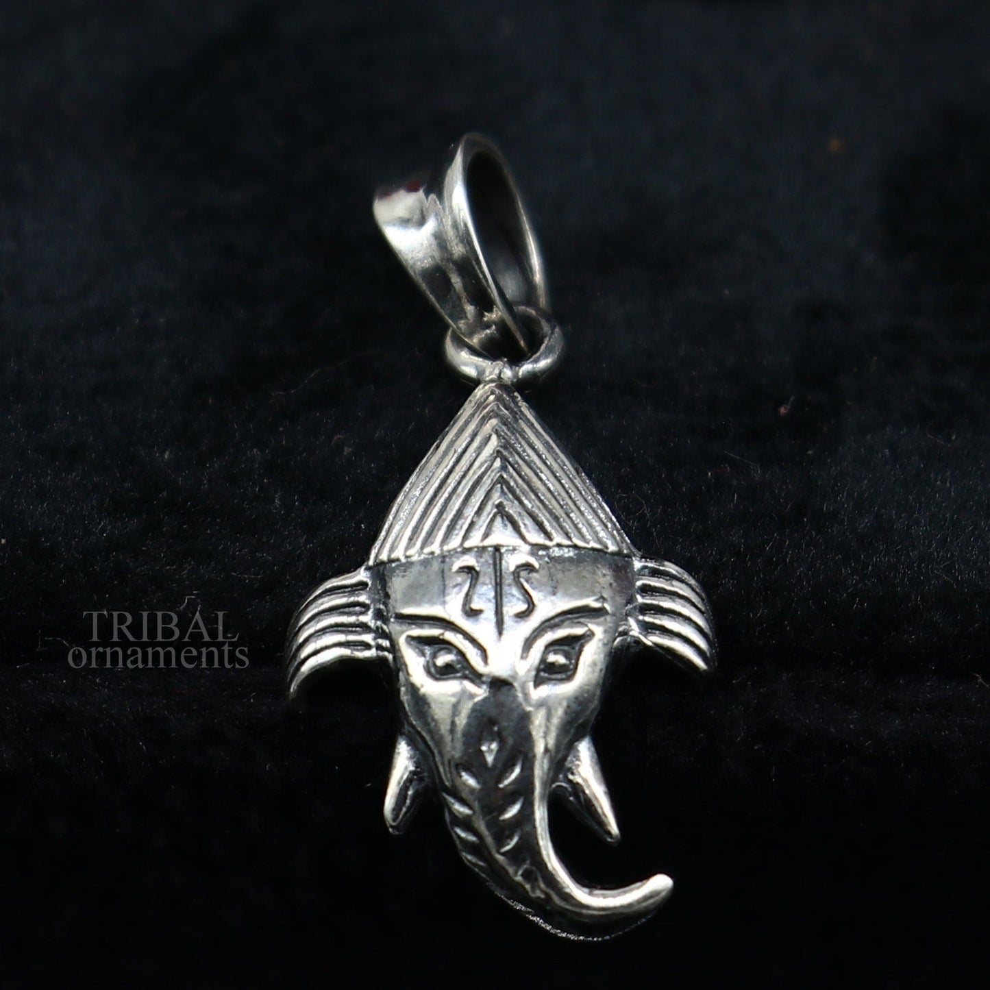 Sterling silver Lord Ganesha pendant by TRIBAL ORNAMENTS, unisex personalized jewelry with intricate design and polished finish.