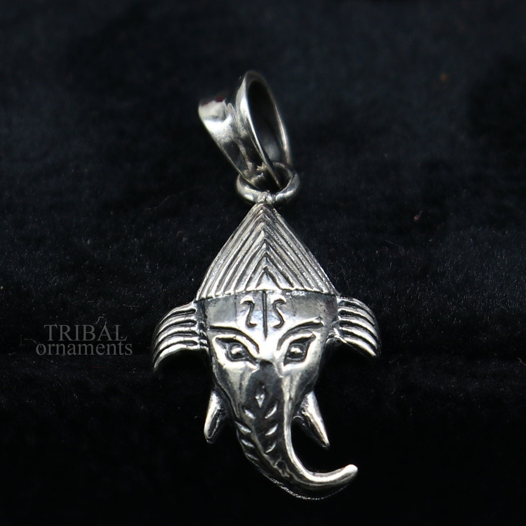 Sterling silver Lord Ganesha pendant by TRIBAL ORNAMENTS, unisex personalized jewelry with intricate design and polished finish.