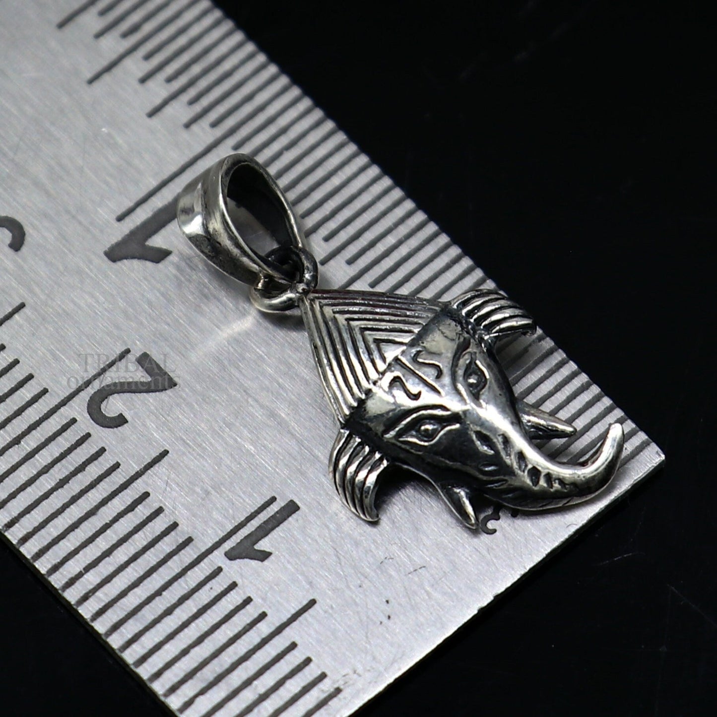 Sterling silver Lord Ganesha pendant by Tribal Ornaments, unisex jewelry with intricate design, perfect personalized gift.