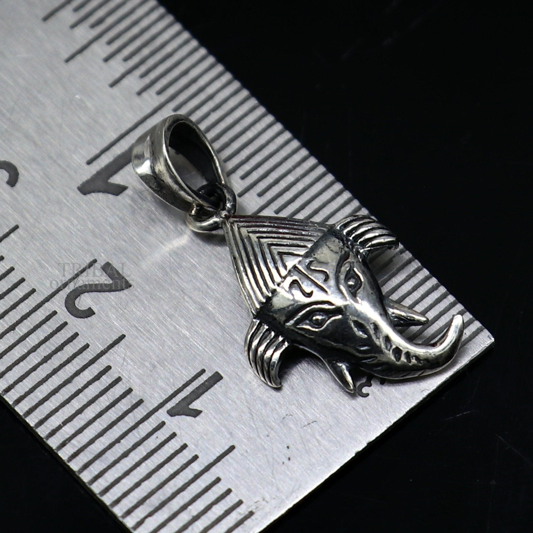 Sterling silver Lord Ganesha pendant by Tribal Ornaments, unisex jewelry with intricate design, perfect personalized gift.
