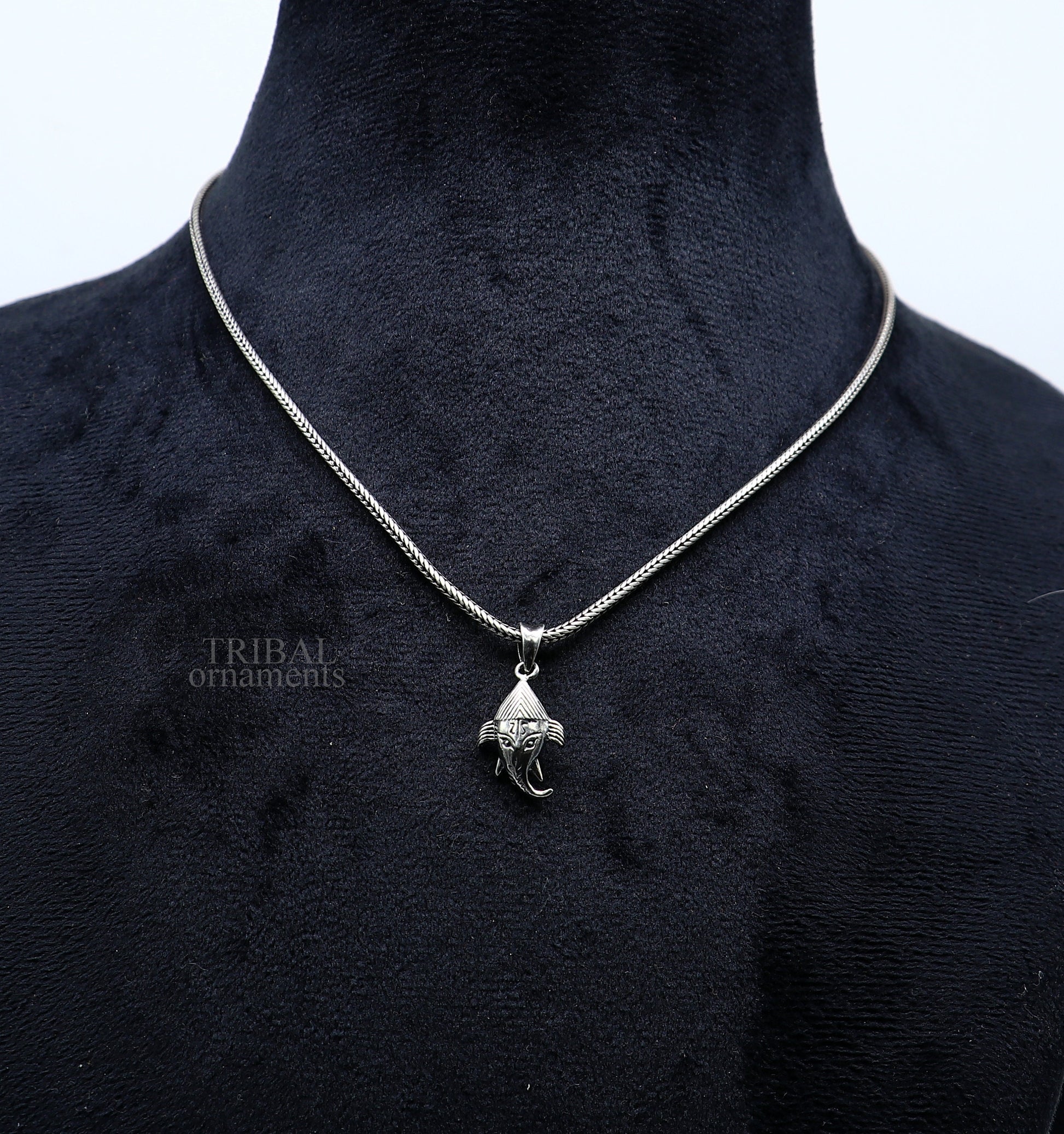Sterling silver Lord Ganesha pendant by TRIBAL ORNAMENTS, unisex personalized jewelry with intricate design for gift-giving.