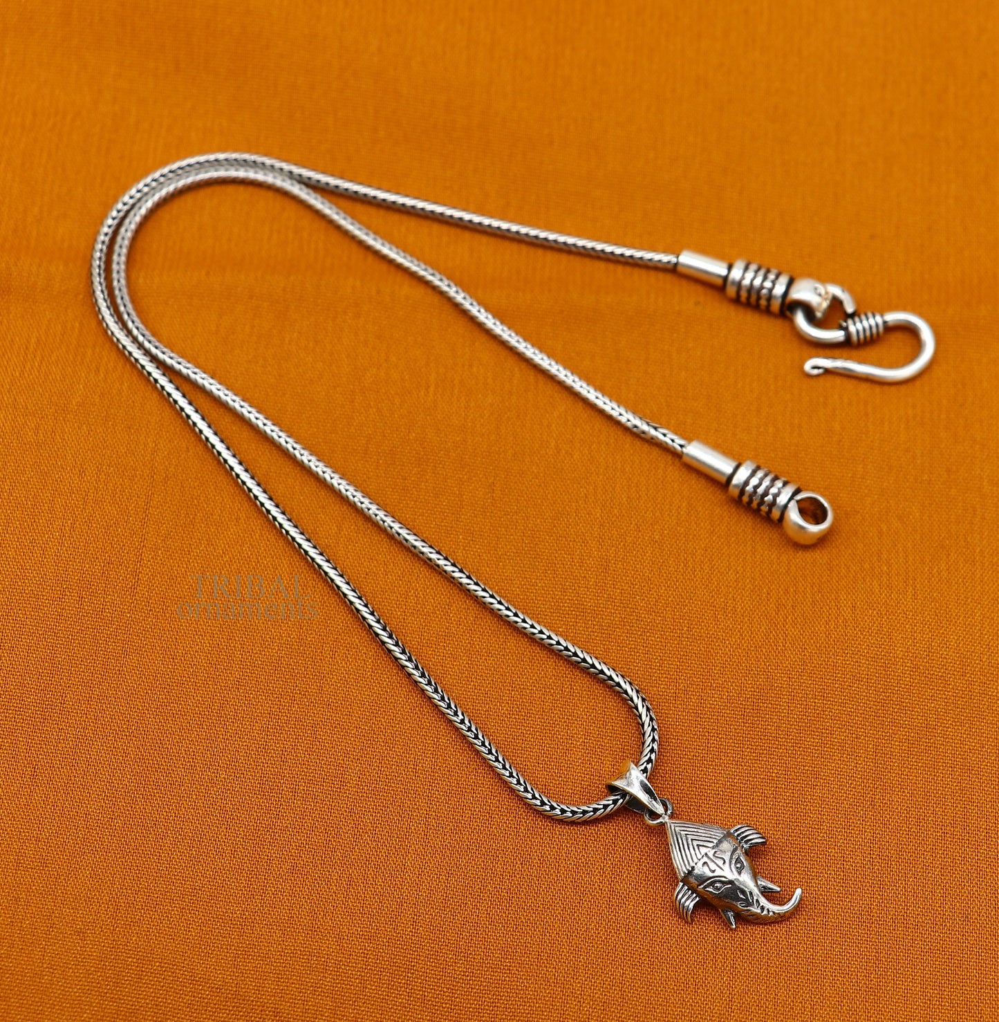 Sterling silver Lord Ganesha pendant by TRIBAL ORNAMENTS, unisex personalized jewelry with intricate design.
