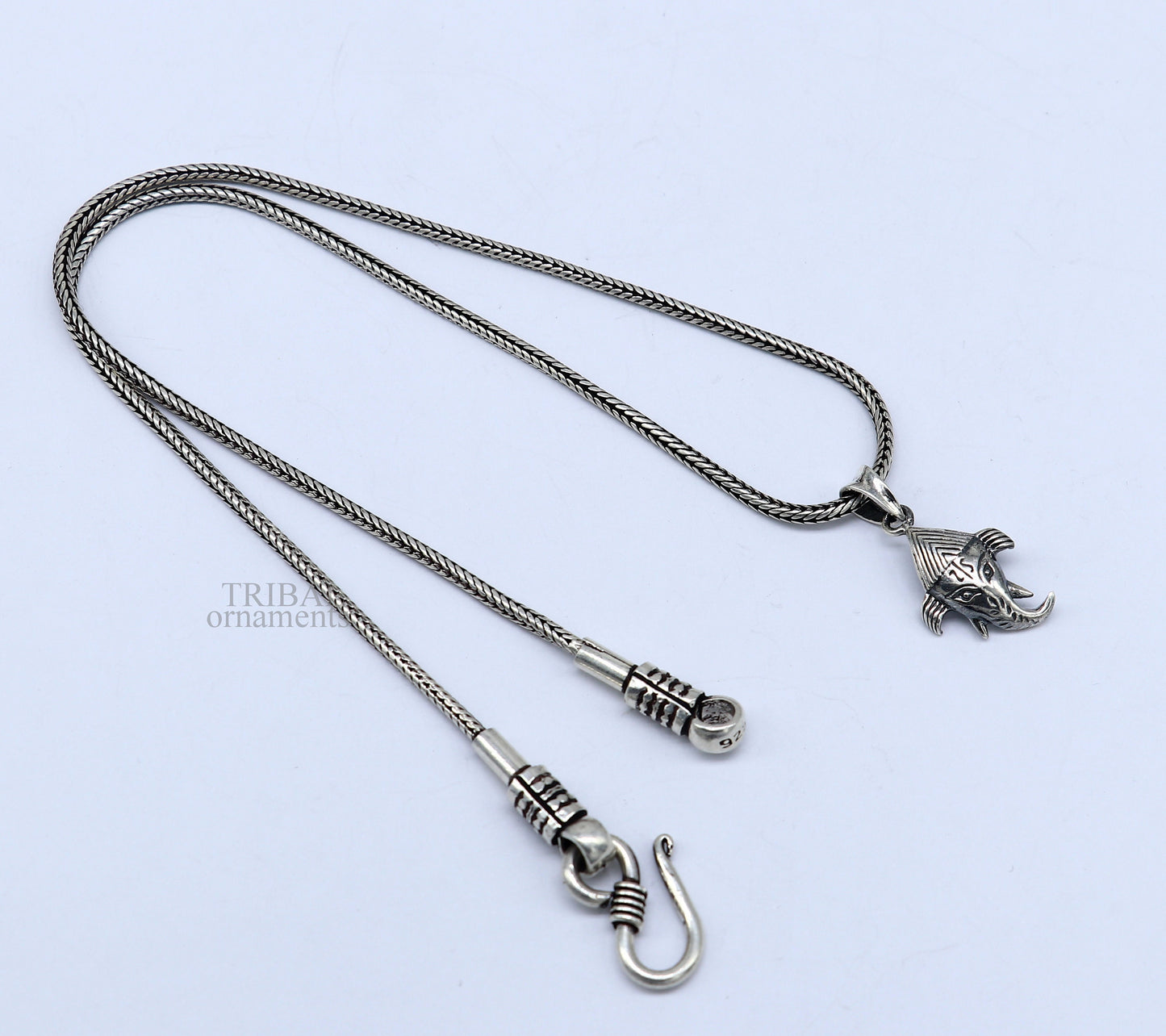 Sterling silver Lord Ganesha pendant by Tribal Ornaments, unisex personalized jewelry with intricate design and stylish craftsmanship.