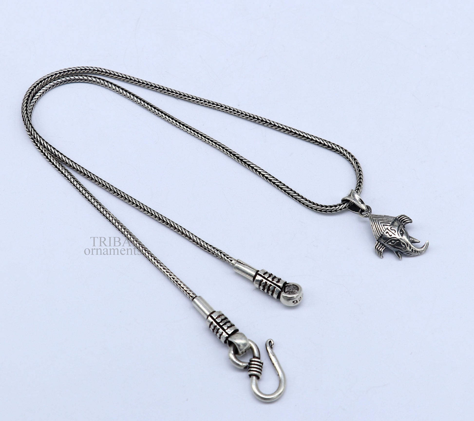 Sterling silver Lord Ganesha pendant by Tribal Ornaments, unisex personalized jewelry with intricate design and stylish craftsmanship.