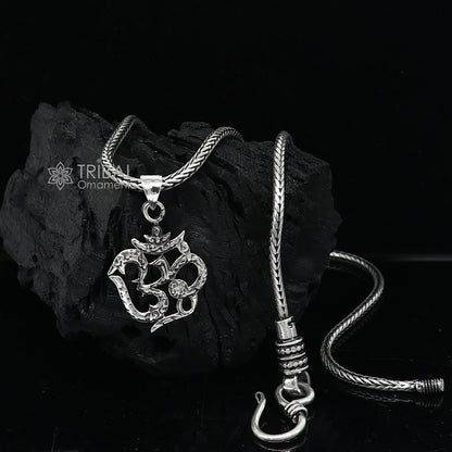 925 silver Divine OM mantra pendant on wheat chain necklace, tribal ornaments with intricate design and delicate craftsmanship.