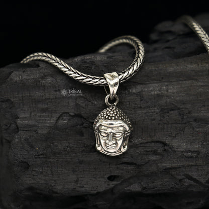 925 silver Lord Buddha face pendant by TRIBAL ORNAMENTS, showcasing intricate details symbolizing inner peace and wisdom.