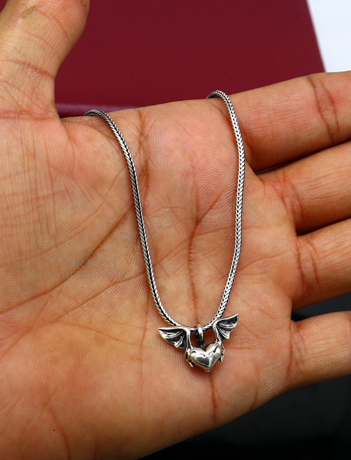 Sterling silver heart with feather pendant by TRIBAL ORNAMENTS, handmade unisex jewelry, stylish gift locket design.