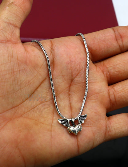 Sterling silver heart with feather pendant by TRIBAL ORNAMENTS, handmade unisex jewelry, stylish gift locket design.