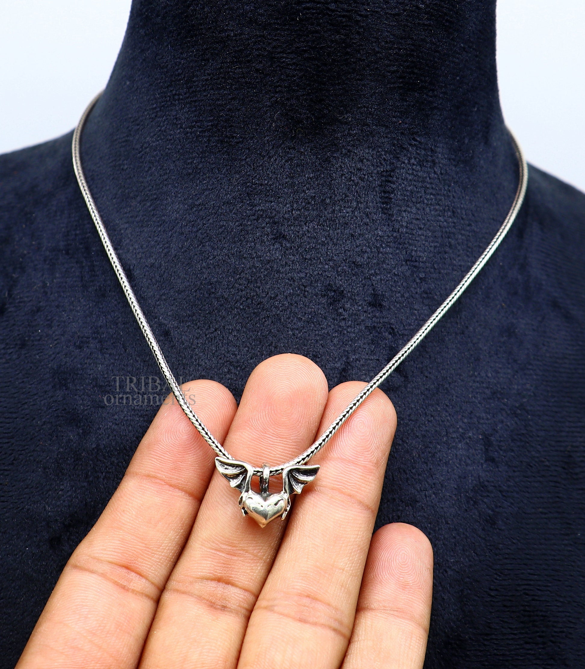 Sterling silver heart pendant with feather design, handmade tribal jewelry, stylish unisex gift necklace by TRIBAL ORNAMENTS.