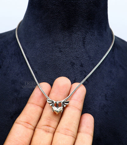 Sterling silver heart pendant with feather design, handmade tribal jewelry, stylish unisex gift necklace by TRIBAL ORNAMENTS.