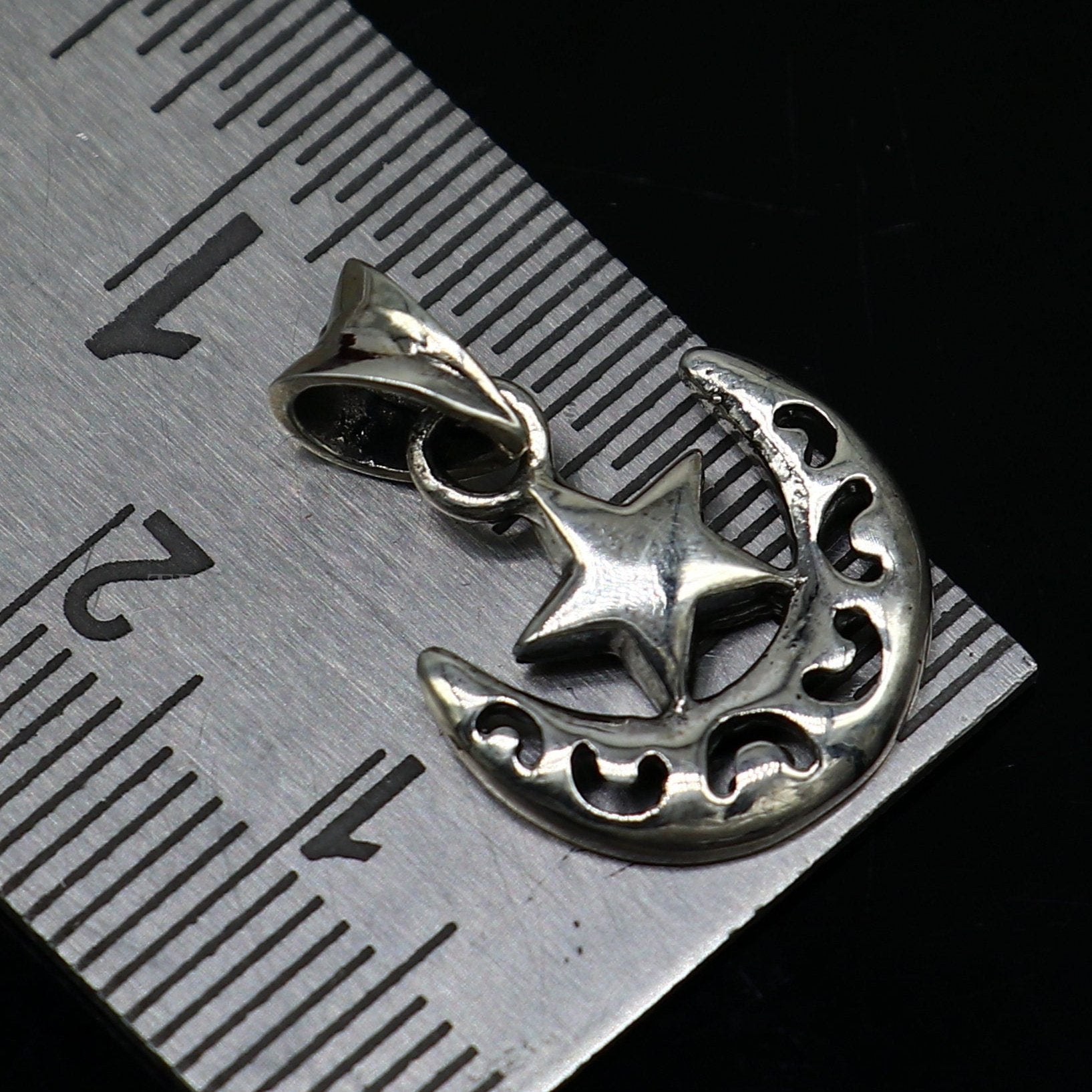 Sterling silver sun, moon, and star pendant by TRIBAL ORNAMENTS, handmade unisex jewelry with custom design and stylish locket.