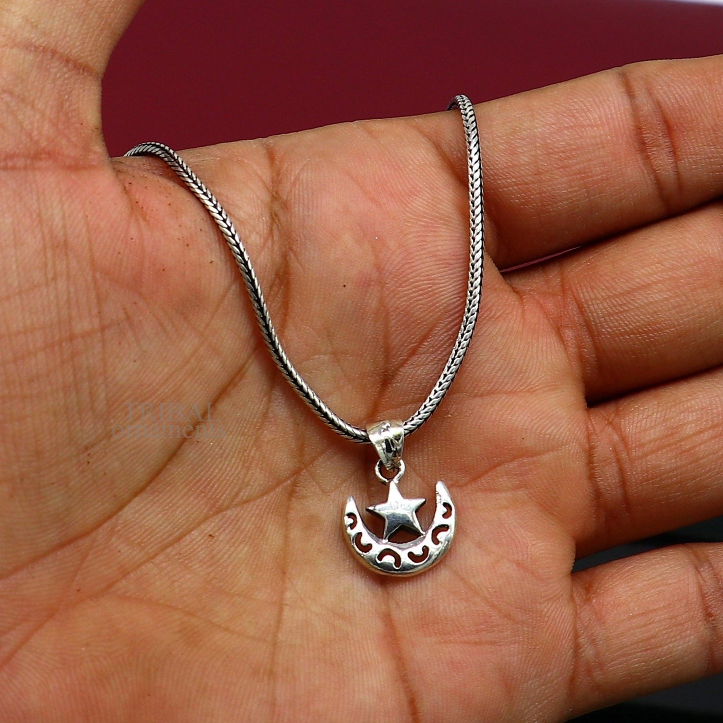 Sterling silver sun, moon, and star pendant by Tribal Ornaments, handcrafted unisex jewelry with custom design and stylish locket.