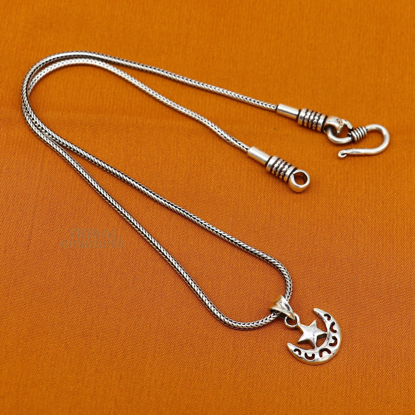 Sterling silver sun, moon, and star pendant from Tribal Ornaments, handcrafted unisex jewelry with customized celestial design.