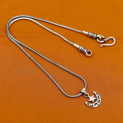 Sterling silver sun, moon, and star pendant from Tribal Ornaments, handcrafted unisex jewelry with customized celestial design.
