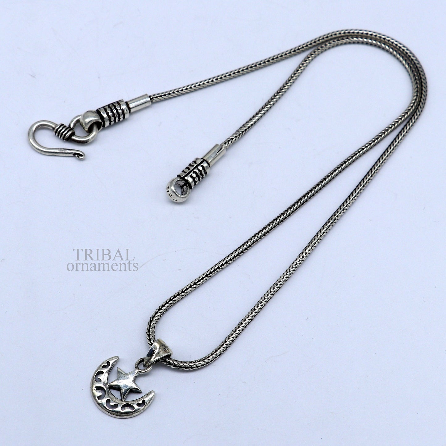 Unisex 925 sterling silver pendant featuring a sun, moon, and star design with customized handmade detailing by TRIBAL ORNAMENTS.