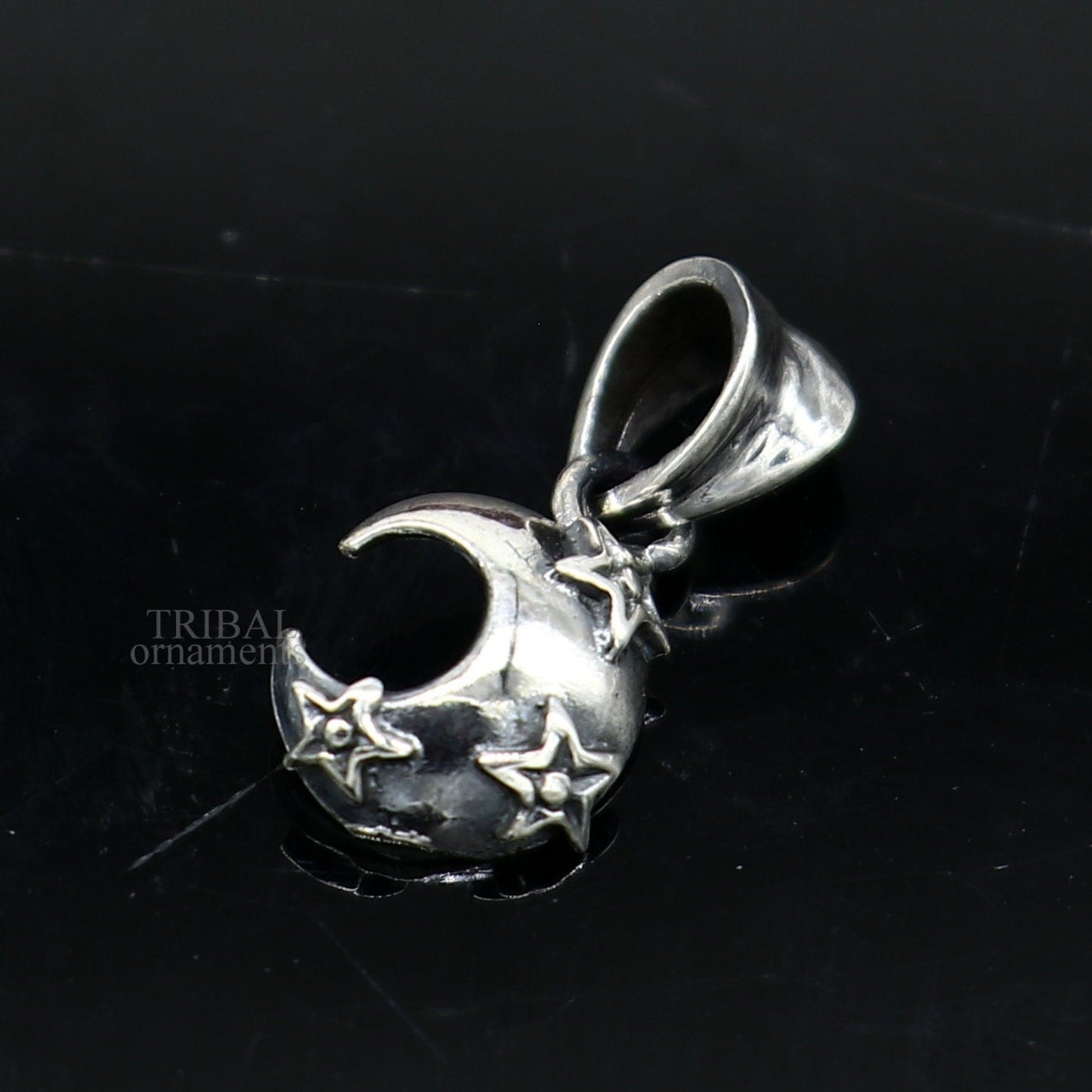 Sterling silver sun, moon, and star pendant by TRIBAL ORNAMENTS, unisex handmade jewelry with detailed celestial design.