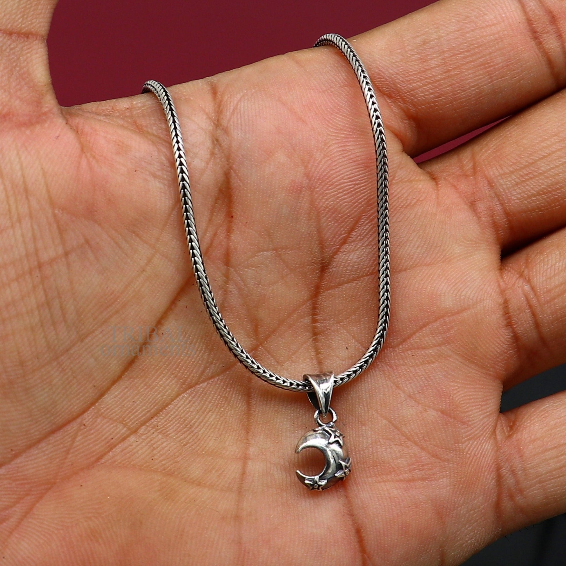 Sterling silver sun, moon, and star pendant by Tribal Ornaments, unisex jewelry with handcrafted celestial design.