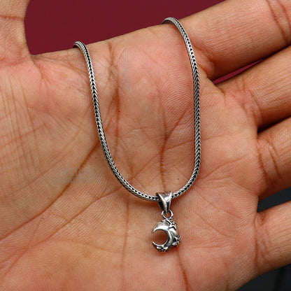 Sterling silver sun, moon, and star pendant by Tribal Ornaments, unisex jewelry with handcrafted celestial design.