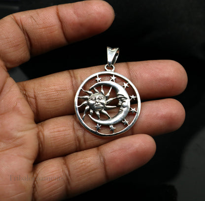 Sterling silver sun, moon, and star pendant by TRIBAL ORNAMENTS, unisex handmade jewelry with intricate celestial design.