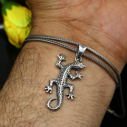 Sterling silver lizard pendant by TRIBAL ORNAMENTS featuring a handmade, attractive design, perfect for gifting jewelry.