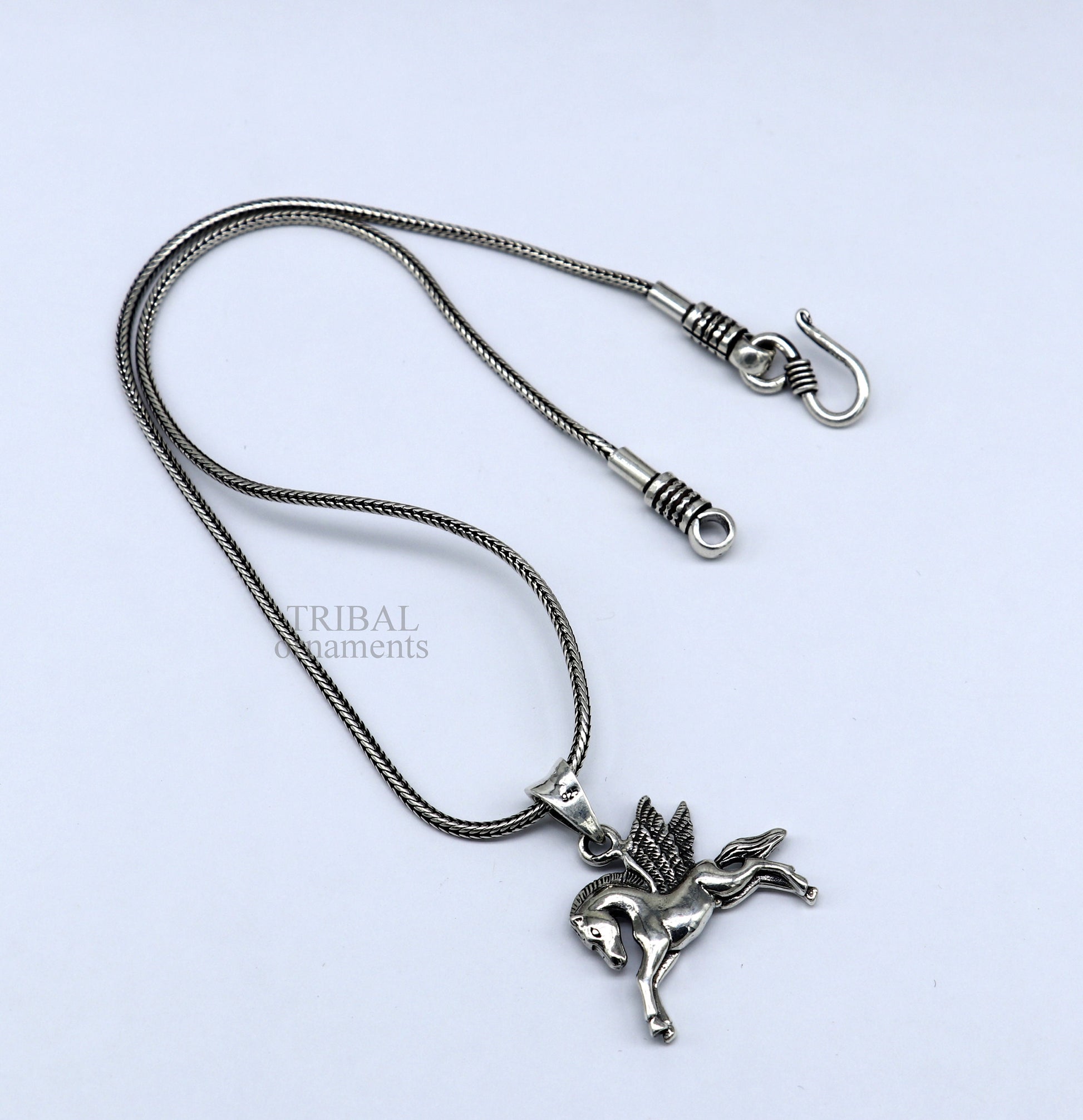 Sterling silver horse unicorn pendant by TRIBAL ORNAMENTS, stylish vintage jewelry for boys and girls, featuring an elegant design.