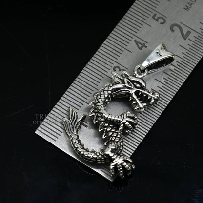 Sterling silver vintage dragon pendant from TRIBAL ORNAMENTS, stylish jewelry for boys and girls, detailed dragon design.