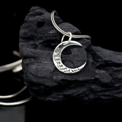 Sterling silver half moon pendant by TRIBAL ORNAMENTS, delicate jewelry for men and women, featuring a sleek, polished design.