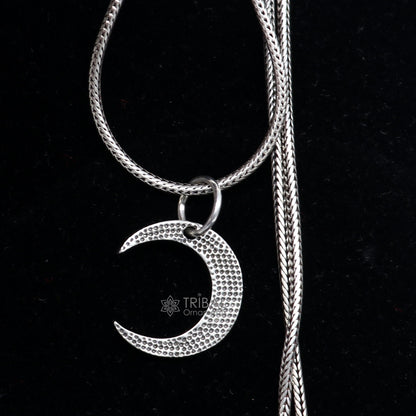 Sterling silver half moon pendant from TRIBAL ORNAMENTS, delicate jewelry for men and women featuring a moon-shaped design.