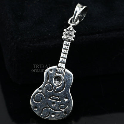 Sterling silver guitar pendant from TRIBAL ORNAMENTS, handcrafted unisex jewelry with a detailed small guitar design.