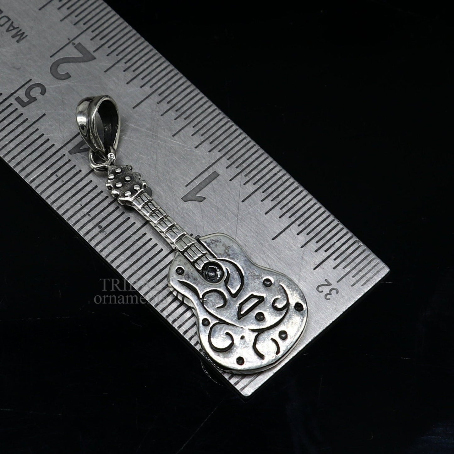 925 silver guitar design pendant by TRIBAL ORNAMENTS, handmade unisex jewelry with intricate tribal-inspired details.