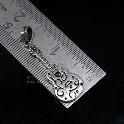 925 silver guitar design pendant by TRIBAL ORNAMENTS, handmade unisex jewelry with intricate tribal-inspired details.