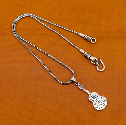 925 sterling silver guitar design pendant by Tribal Ornaments, unisex jewelry with a handmade tribal-inspired small guitar charm.