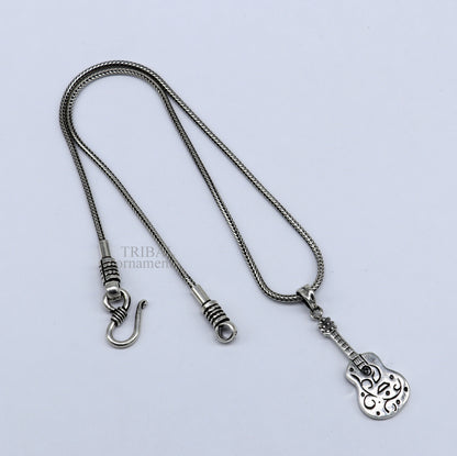Sterling silver guitar design pendant by TRIBAL ORNAMENTS, unisex handmade tribal jewelry, stylish small guitar-shaped pendant.