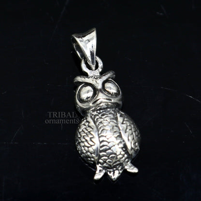 Small 925 sterling silver owl pendant by TRIBAL ORNAMENTS, unisex good luck jewelry with intricate tribal design.
