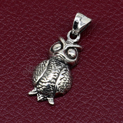 Sterling silver small owl pendant by TRIBAL ORNAMENTS, unisex good luck jewelry with intricate tribal design.