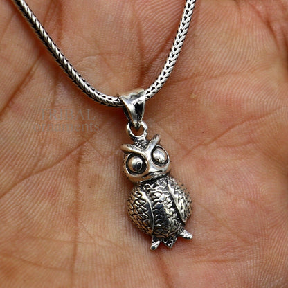 Small 925 sterling silver owl pendant from Tribal Ornaments, unisex good luck jewelry with intricate tribal design.