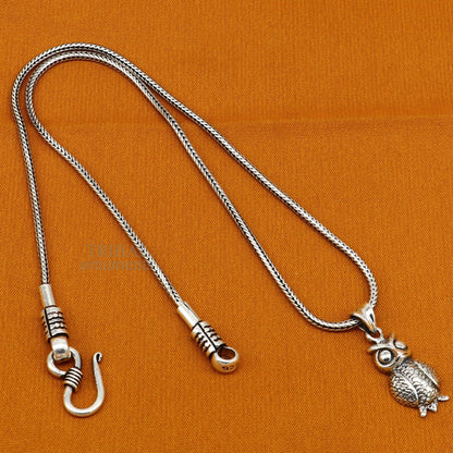 Small 925 sterling silver owl pendant by Tribal Ornaments, stylish unisex good luck jewelry with intricate tribal design.