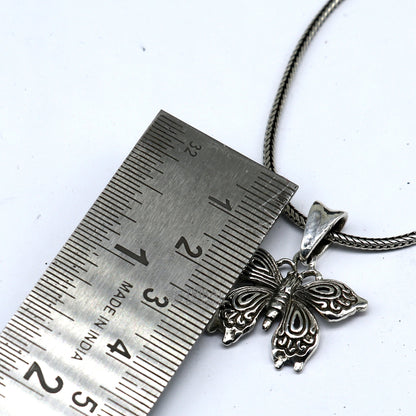 Sterling silver butterfly pendant with bird design, unisex handmade jewelry by Tribal Ornaments, delicate silver necklace accessory